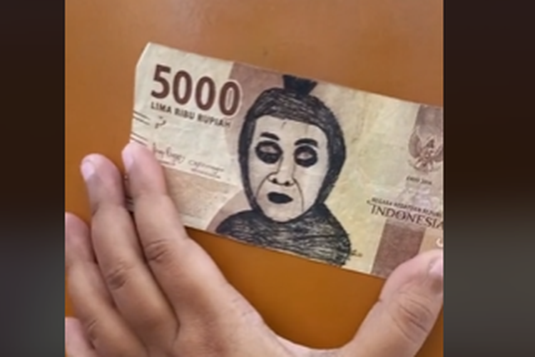 Tangkapan layar video TikTok yang menampilkan uang pecahan Rp 5.000 dicoret-coret