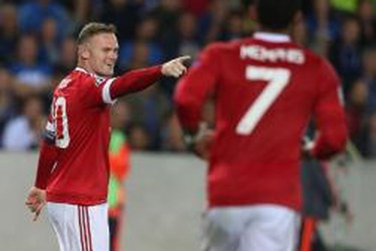 Wayne Rooney mencetak hat-trick saat Manchester United menang 4-0 atas Brugge, Rabu (26/8/2015). 