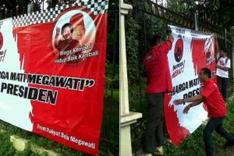 Relawan Pro Demokrasi mencopot spanduk dukungan kepada Megawati Soekarnoputri untuk menjadi Presiden RI di perempatan Pancoran, Jakarta, Senin (5/5/2014) sore.