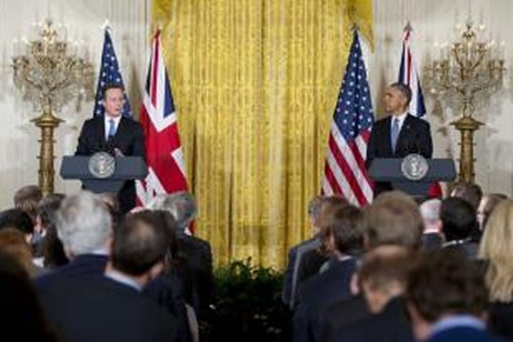 Perdana Menteri Inggris David Cameron dan Presiden Amerika Serikat Barack Obama melakukan konferensi pers bersama usai pertemuan di Gedung Putih, Jumat (16/1/2015).