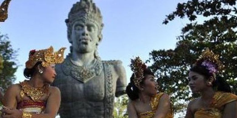 Some Balinese dancers share light moment after their traditional dance performance at Garuda Wisnu Kencana Cultural Park in Bali.  