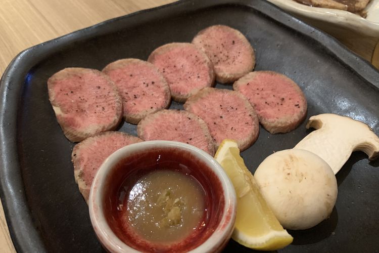 Sliced ​​wooseol (beef tongue) with Korean BBQ yuzu sauce at Samwon by Samwon Garden Grand Indonesia.