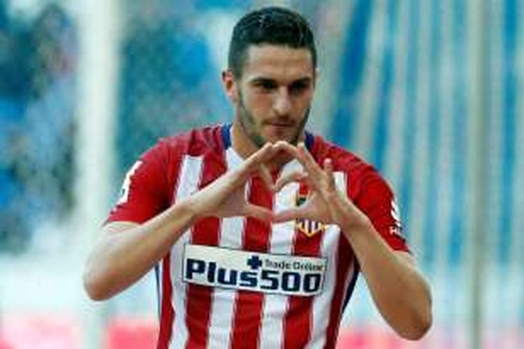 Gelandang Atletico Madrid, Koke, merayakan golnya ke gawang Espanyol pada partai La Liga di Stadion Cornella-El Prat, 9 April 2016.