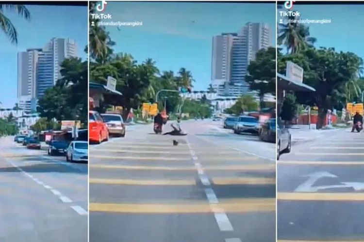 Tangkapan layar dari video buah kelapa jatuh menimpa kepala pengendara motor di Teluk Kumbar, Penang, Malaysia.
