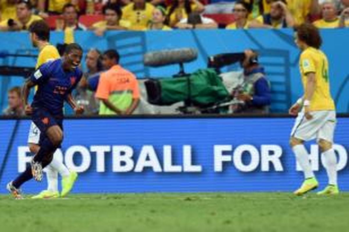 Gelandang Belanda, Georginio Wijnaldum, seusai mencetak gol ke gawang Brasil dalam perebutan tempat ketiga Piala Dunia 2014 di Estadio Nacional, Brasilia, Sabtu (12/7/2014). 