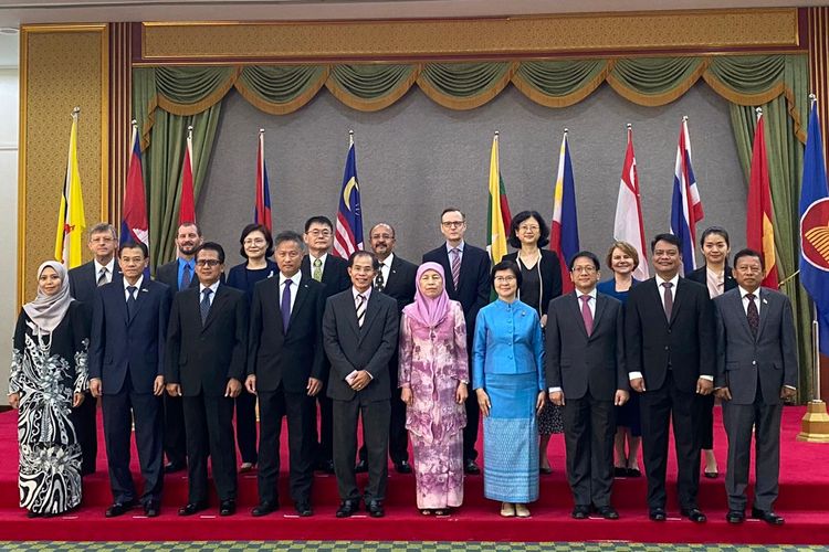 Foreign ambassadors to Brunei Darussalam, including the envoys from the ASEAN Member States, and Permanent Secretary at Brunei's Ministry of Foreign Affairs and Trade Emaleen Abdul Rahman Teo pose a photo during an event to mark the 53rd anniversary of ASEAN held at the International Convention Center in Bandar Seri Begawan on August 10, 2020.  