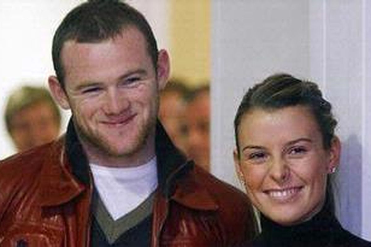 Wayne Rooney, striker Manchester united, dan istrinya Coleen.