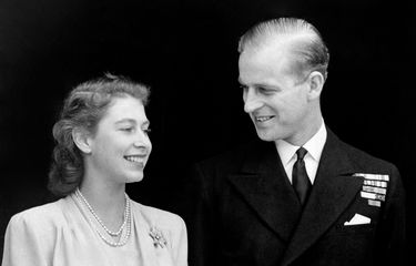 Smiling happily the Princess and her fiance, Lieut. Philip Mountbatten are pictured at Buckingham Palace. Princess Elizabeth's engagement ring is plainly visible in the picture