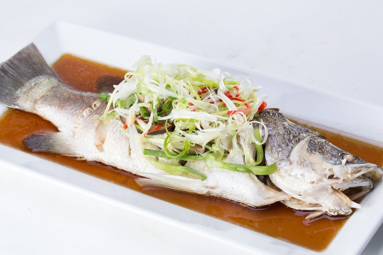 A steamed fish, a typical way to prepare milkfish, crucian carp or catfish for Chinese New Year banquets