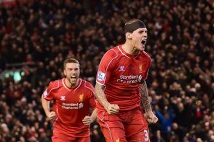 Bek Liverpool, Martin Skrtel, meluapkan kegembiraannya setelah membobol gawang Arsenal, Minggu (21/12/2014). 