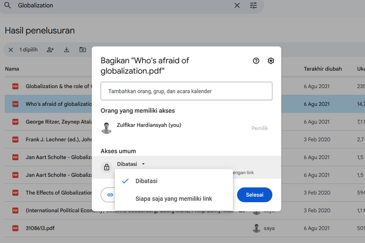 Ilustrasi cara menggunakan Google Drive di laptop untuk berbagi file.