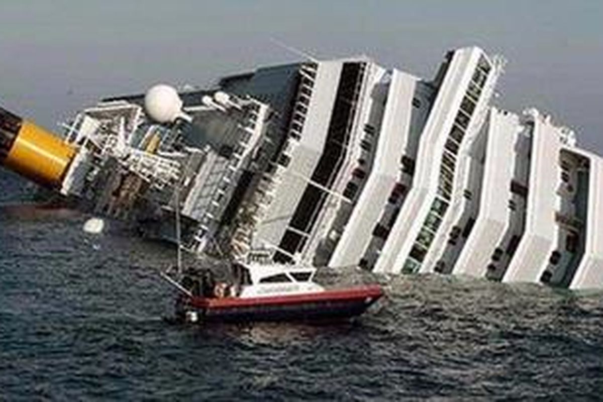 Sinking ... Costa Concordia leans on its side. 