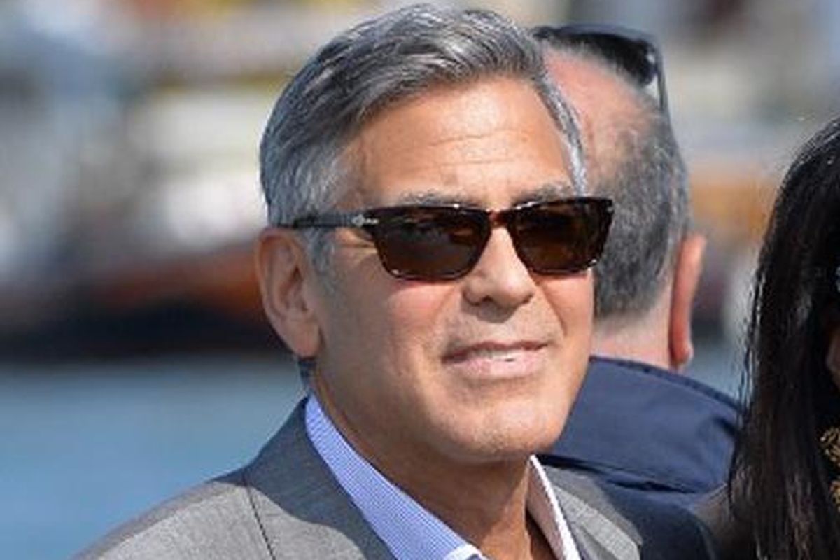 Aktor Hollywood papan atas George Clooney dan Amal Alamuddin, pengacara hak asasi manusia asal Inggris, saat tiba do Venice, Jumat (26/9/2014). Di kota itu keduanya melangsungkan pernikahan. 