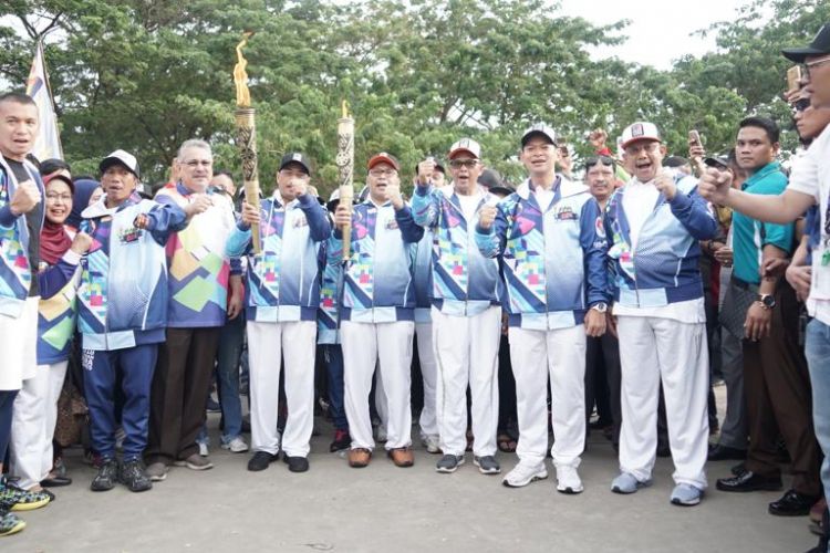 Pelaksanaan pawai obor Asian Para Games 2018 di kota Anging Mamiri, Makassar, Rabu (12/9/2018).