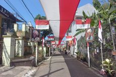 Warga Malang Bentangkan Bendera Merah Putih Sepanjang 308 Meter di Sepanjang Jalan