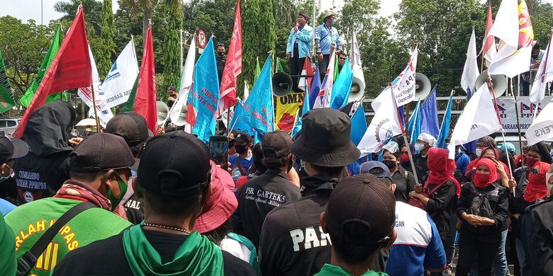 Workers stage protest against the newly passed Job Creation Law in Bogor, West Java on Friday October 16, 2020. 