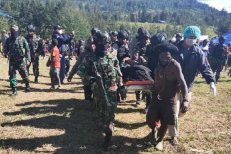 Indonesian authorities evacuate the remains of 16-year old Ali Mom, a high school student killed by insurgents in Papua's Puncak regency
