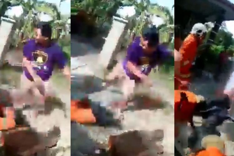 Tangkapan layar dari video warga desa di Sarawak, Malaysia, memukul petugas pemadam kebakaran karena menurutnya datang terlambat untuk memadamkan api yang membakar sebuah rumah, pada Sabtu (19/6/2021).