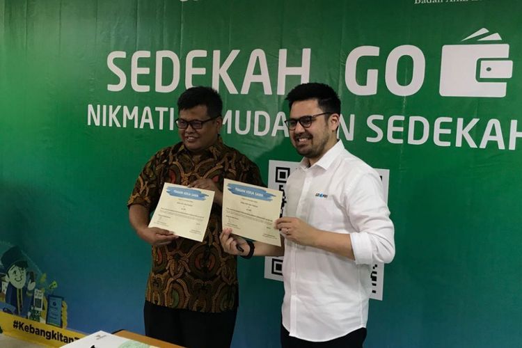Deputi BAZNAS Arifin Purwakananta bersama Managing Director Go-Pay Budi Ganda Soebrata saat di kantor Baznas, Jakarta, Rabu (16/5/2018).