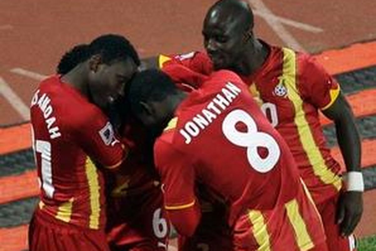 Ghanas Asamoah Gyan is hidden by celebrating teammates after he scored their sides second goal during the World Cup round of 16 soccer match between the United States and Ghana at Royal Bafokeng Stadium in Rustenburg, South Africa, on Saturday, June 26, 2010. 