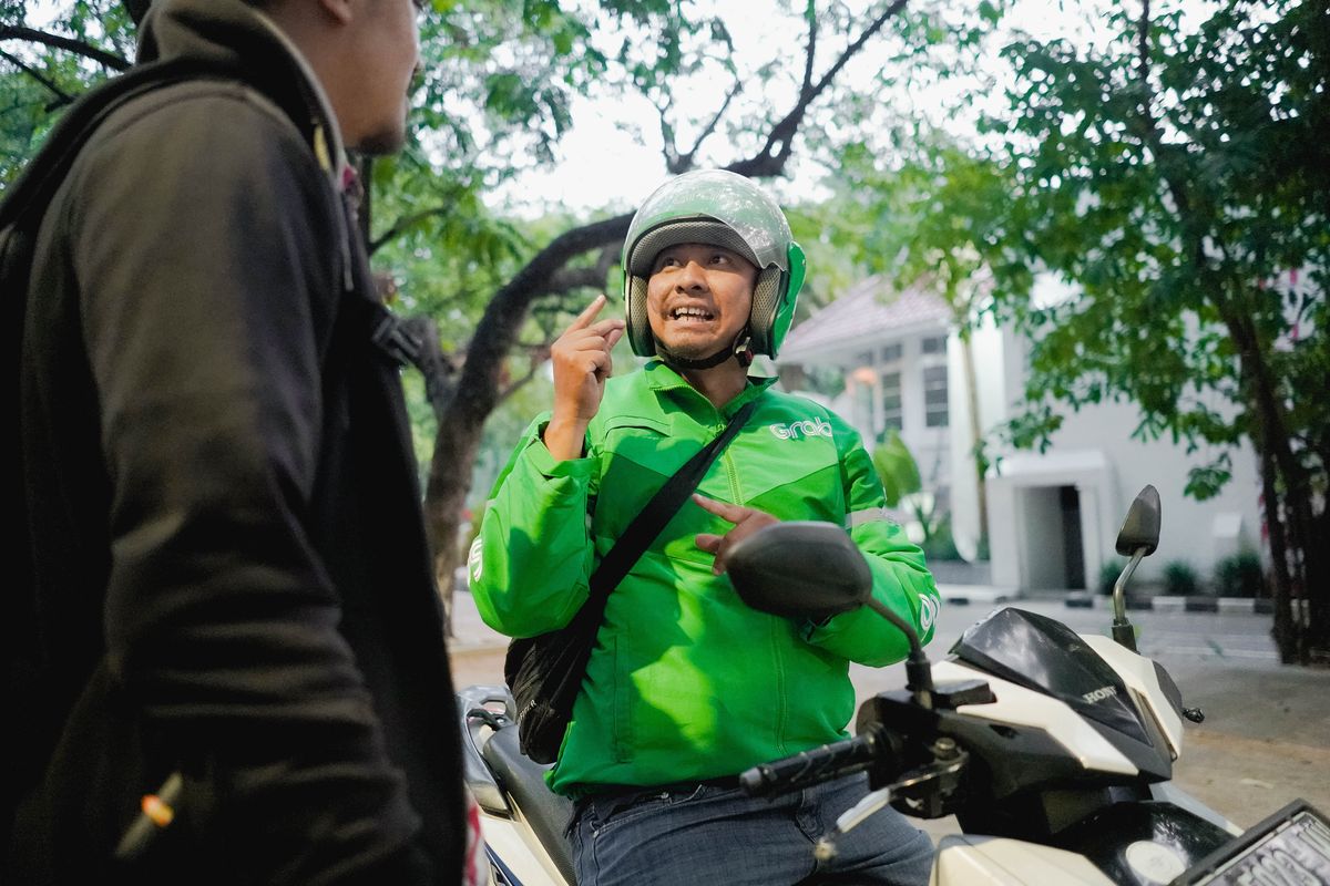 Ilustrasi mitra pengemudi penyandang disabilitas. Bonar merupakan mitra pengemudi tuli Grab Bike.