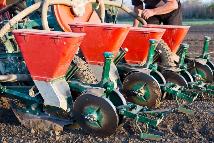 Ilustrasi seed planter, alat yang digunakan untuk menanam benih. 