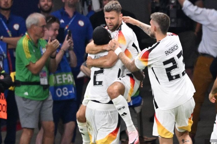 Penyerang Timnas Jerman, Niclas Fuellkrug, merayakan gol ke gawang Swiss. Der Panzer bermain imbang 1-1 saat menghadapi Swiss pada laga Grup A di Frankfurt Arena pada Minggu (23/6/2024) atau Senin dini hari WIB.