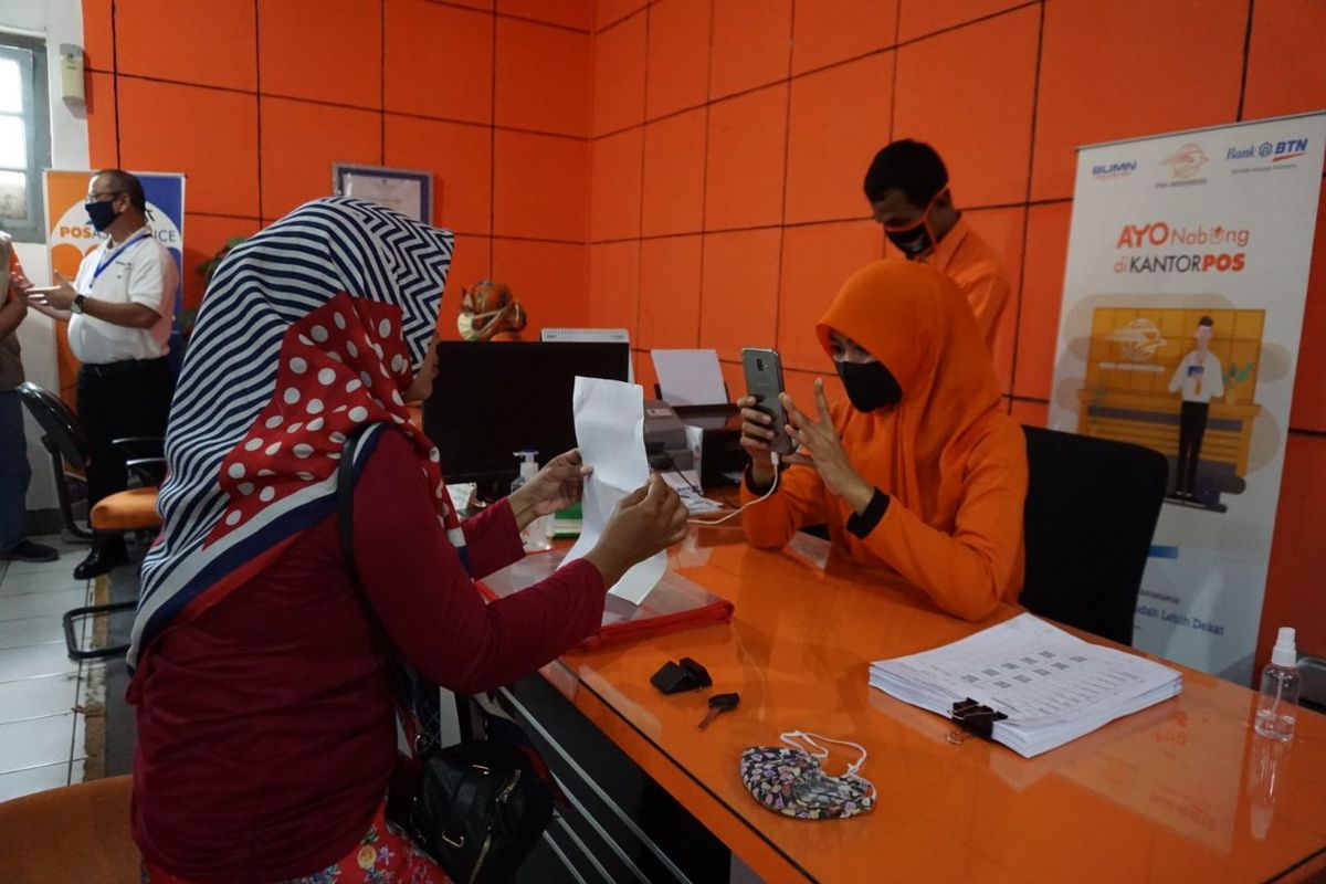 Ilustrasi penyaluran BST dengan Kantor Pos.