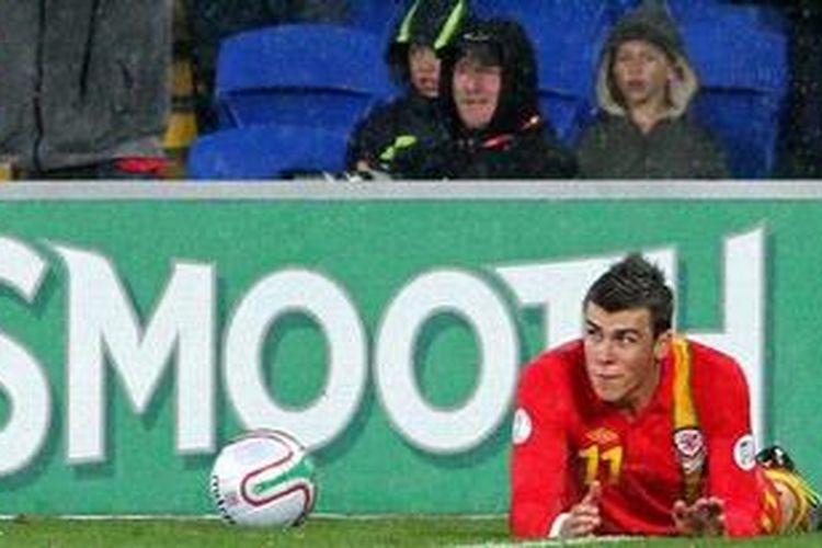 Reaksi gelandang Wales, Gareth Bale, dalam laga penyisihan grup Pra-Piala Dunia Brasil 2014 melawan Skotlandia di Stadion Cardiff City, Cardiff, Jumat (12/10/2012). October 12, 2012. Bale memborong kedua gol kemenangan 201 Wales atas Skotlandia. 