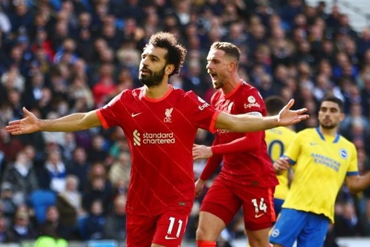Penyerang Liverpool Mohamed Salah merayakan gol ke gawang Brighton & Hove Albion dalam laga lanjutan Liga Inggris musim 2021-2022 di Stadion Amex pada Sabtu (12/3/2022) malam WIB.