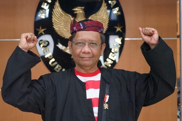 Coordinating Minister for Political, Legal and Security Affairs Mahfud MD wearing a traditional Sakera costume from Madura Island in East Java