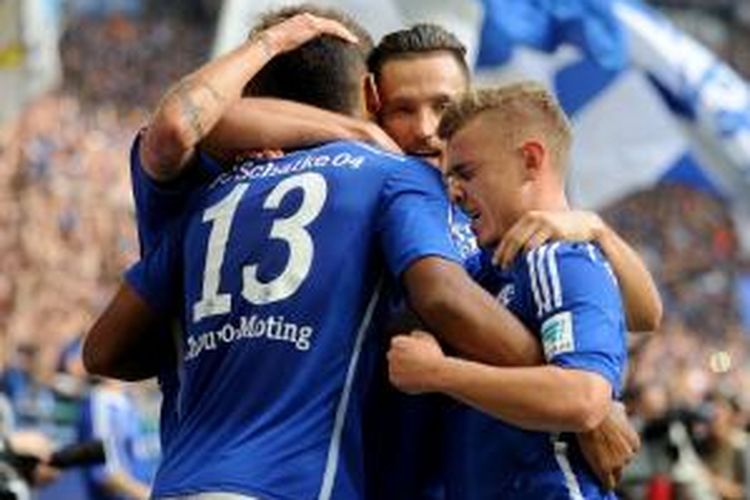 Schalke 04 berhasil mengalahkan Borrusia Dortmund dengan skor 2-1 pada pertandingan lanjutan Bundesliga 1, Sabtu (27/9/2014). 