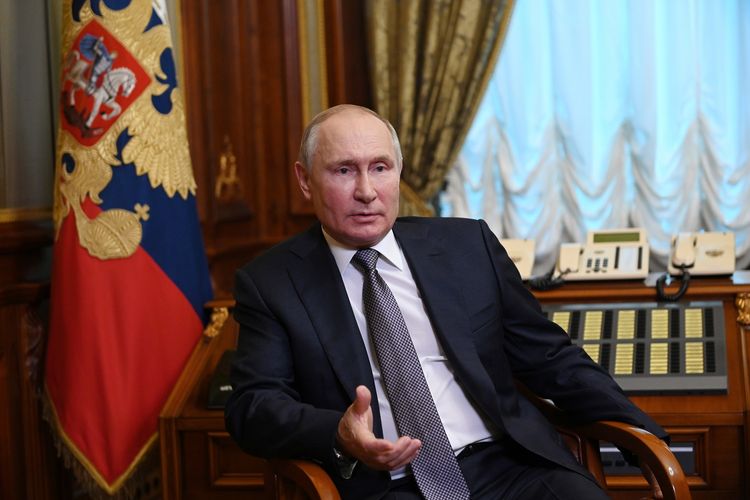 Russian President Vladimir Putin speaks to a journalist in St Petersburg, Russia, on July 13, 2021. Putin describes Russia and Ukraine as one person, and argues that Ukraine can be stable and successful if it maintains good relations with Russia.