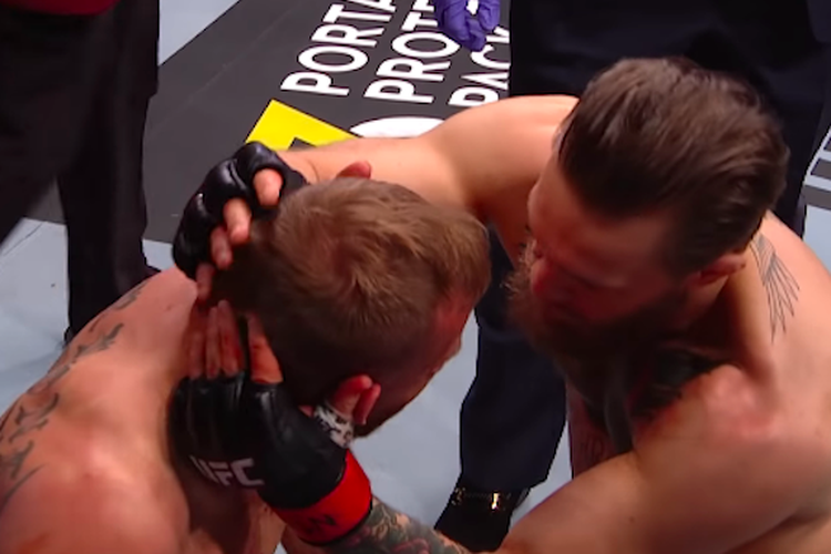 Petarung bintang UFC, Conor McGregor, merangkul lawannya, Donald Cerrone, pada ajang UFC 246, pada Minggu (19/1/2020) pagi hari WIB.