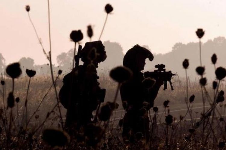 Tentara Israel dari Brigade Golani menghadiri latihan militer di Dataran Tinggi Golan dekat perbatasan dengan Suriah, 26 Juni 2013. Dataran Tinggi Golan direbut oleh Israel dari Suriah dalam Perang Enam Hari 1967.