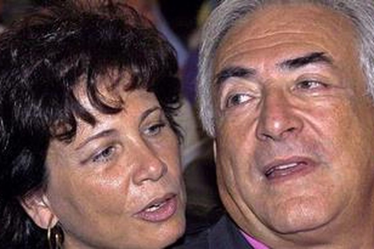 Dogged by scandal: Dominique Strauss-Kahn is seen with his wife and leading French journalist Anne Sinclair  