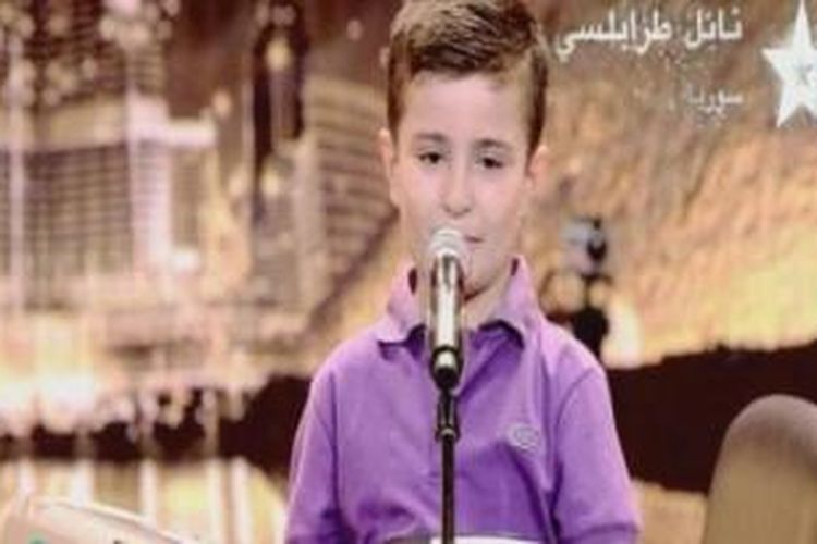 Nael Traboulsi (8) bocah asal kota Homs, Suriah yang memiliki bakat luar biasa dalam memainkan piano.