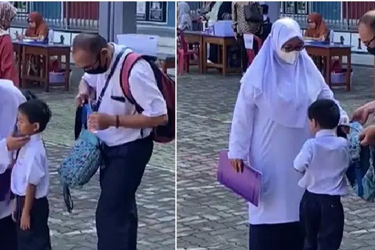 Mohd Fadzil (41) dan Nurul Aini Mohd Olwi (41) menyemangati anaknya saat hari pertama sekolah dengan memakai seragam SD di Malaysia.