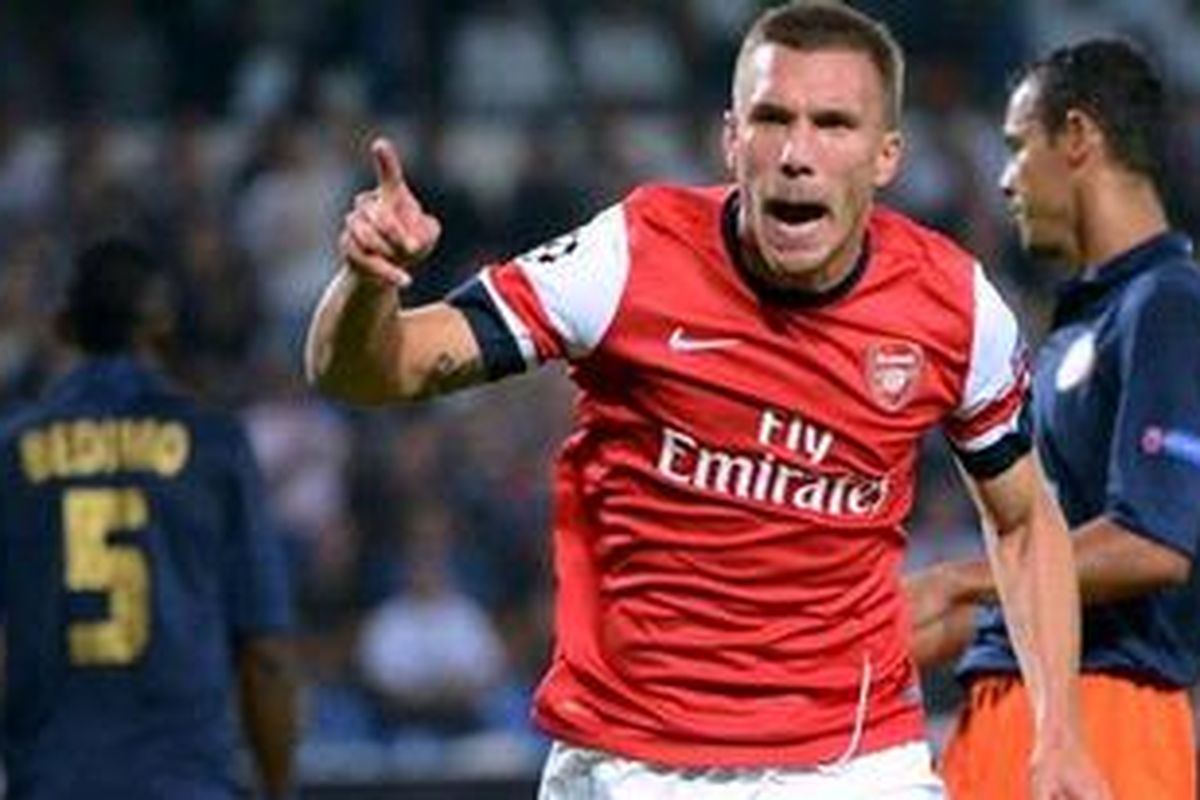 Ekspresi penyerang Arsenal, Lukas Podolski, usai mencetak gol pertama "The Gunners" saat melawan Montpellier di laga perdana penyisihan Grup B Liga Champions, Selasa atau Rabu (19/9/2012). Arsenal berhasil memenangkan laga tersebut 2-1. 