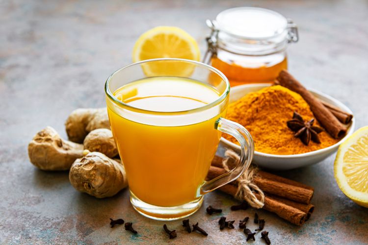 Illustration of ginger turmeric tea, turmeric boiled water and cinnamon.