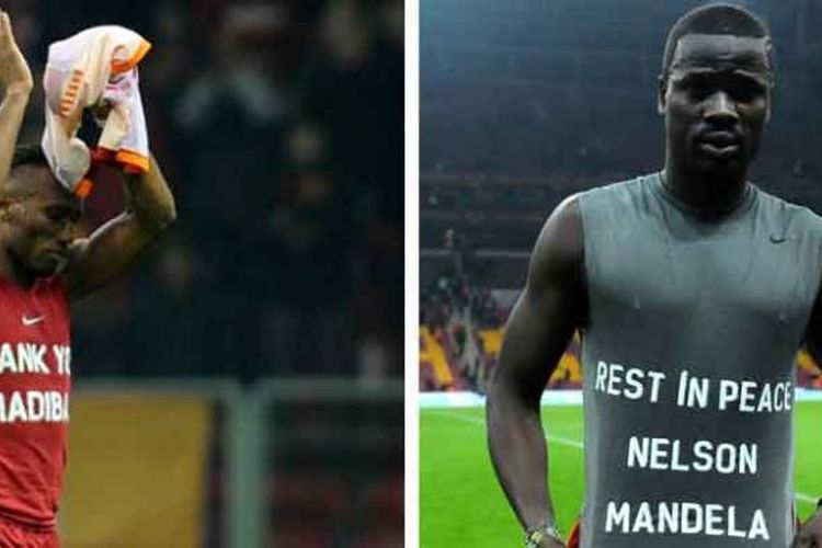 Dua pemain Galatasaray asal Pantai Gading, Didier Drogba (kiri) dan Emmanuel Eboue mengenakan kostum dengan tulisan yang intinya menghormati mantan Presiden Afrika Selatan, Nelson Mandela, dalam sebuah pertandingan di Liga Turki antara Galatasaray dan Elazigspor, Jumat (6/12/2013), di Turk Telekom Arena, Istanbul. 