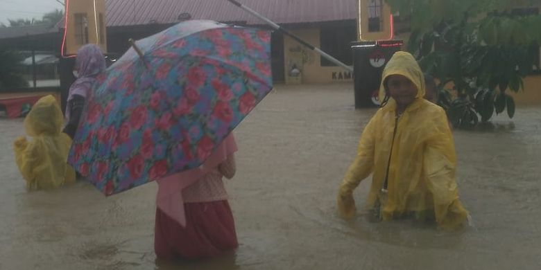 Residents in flood affected areas in Matangkuli sub-district in North Aceh on Sunday, December 6, 2020.  