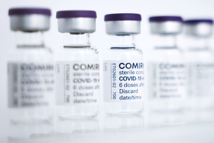 FILE - Empty vials to be filled with the Pfizer/BioNTech vaccine are seen at a production facility in Reinbek, near Hamburg, Germany, April 30, 2021.