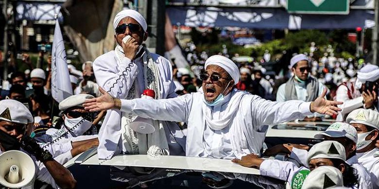 Rizieq Shihab, leader of the Islamic Defenders Front, greets his followers in Puncak, Bogor, West Java on November 13, 2020. 
