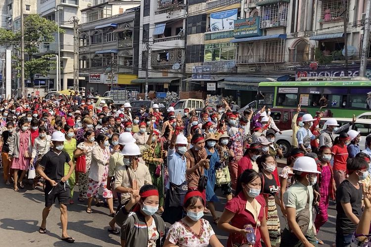 In this image from video, a crowd of protesters march in Yangon, Myanmar Saturday, Feb. 6, 2021. The military authorities in charge of Myanmar broadened a ban on social media following this week's coup, shutting access to Twitter and Instagram, while street protests continued to expand Saturday as people gathered again to show their opposition to the army takeover. (AP Photo)