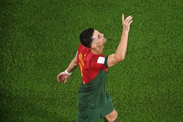 Cristiano Ronaldo merayakan golnya dalam pertandingan Portugal vs Ghana pada laga Grup H Piala Dunia 2022 di Stadium 974, Doha, Qatar, Kamis (24/11/2022). (Foto oleh Kirill KUDRYAVTSEV / AFP)