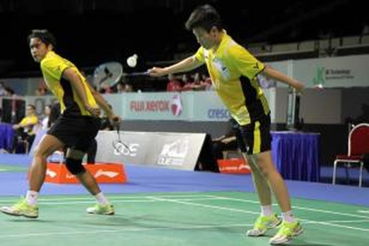 Pebulu tangkis ganda campuran Indonesia Tontowi Ahmad/Liliyana Natsir beraksi di babak kedua Singapore Open Superseries, Kamis (10/4/2014).