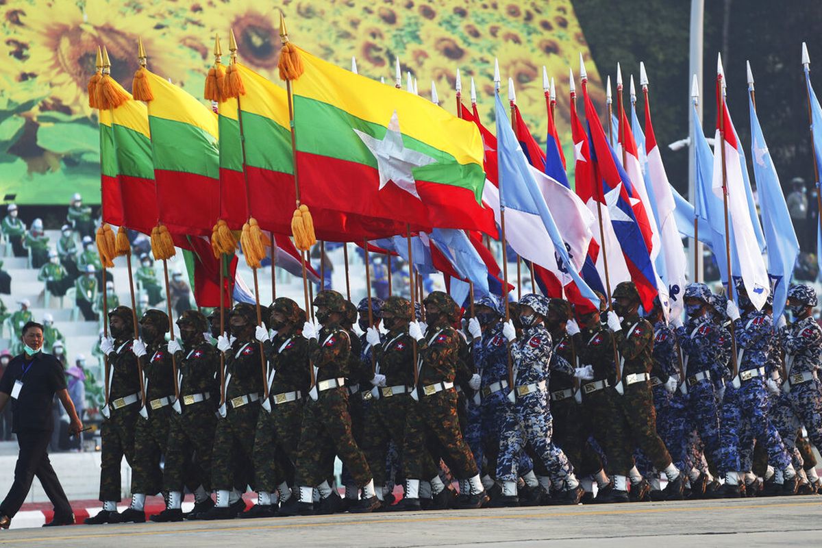 (FILE) Myanmar military officers march during a ceremony to mark the 75th anniversary of Union Day Saturday, February 12, 2022, in Naypyitaw, Myanmar. The occasion is celebrated for the date in 1947 when many of the country's ethnic groups signed an agreement to unify following decades of British colonial rule, but it was ineffective, and efforts at unity remain failed. 