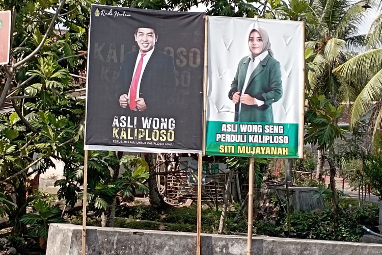 Banner mantan pasangan suami istri yang bertarung di Pilkades Desa Kaliploso pada Pilkades serentak Banyuwangi, Jawa Timur, Rabu (25/10/2023)