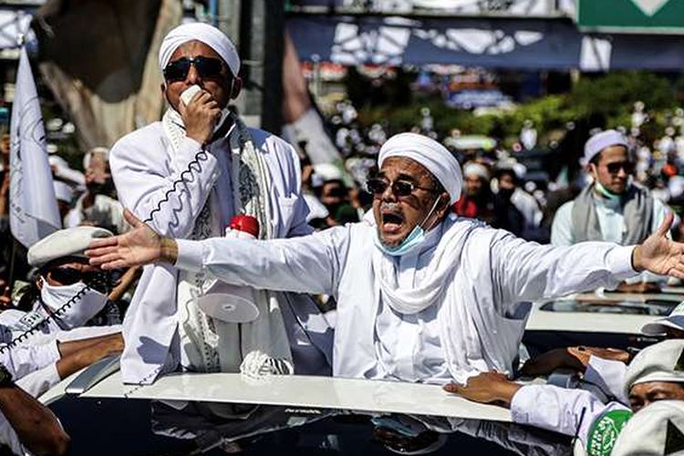 Rizieq Shihab, leader of the Islamic Defenders Front, greets his followers in Puncak, Bogor, West Java on November 13, 2020. 